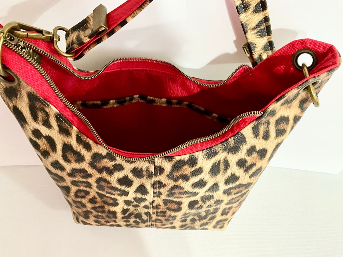 Open bag showing red waterproof canvas lining and pockets