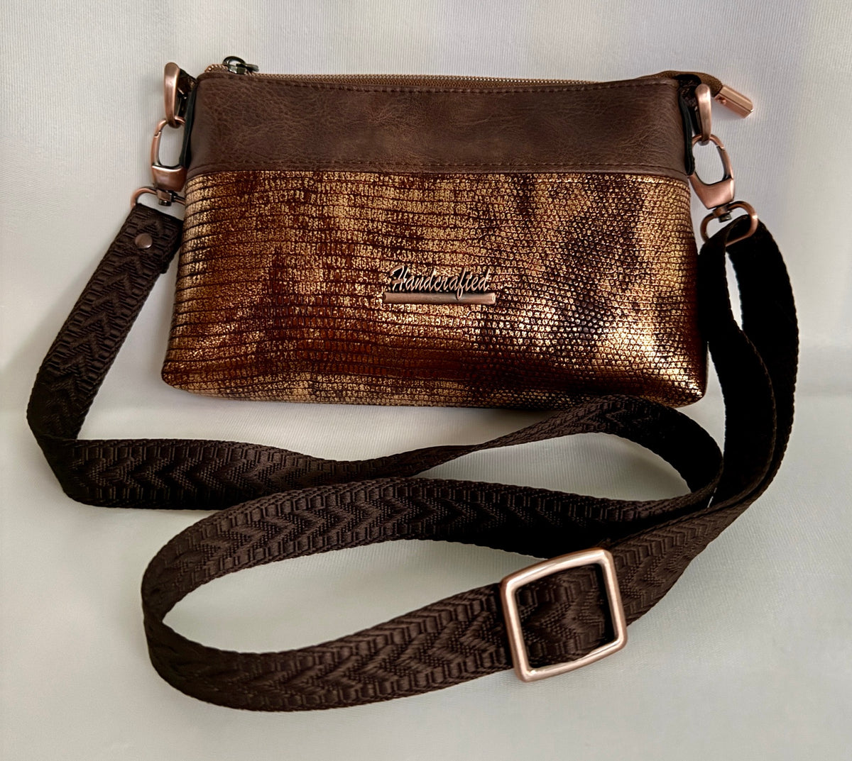 Metallic brown copper faux leather crossbody bag with solid brown top